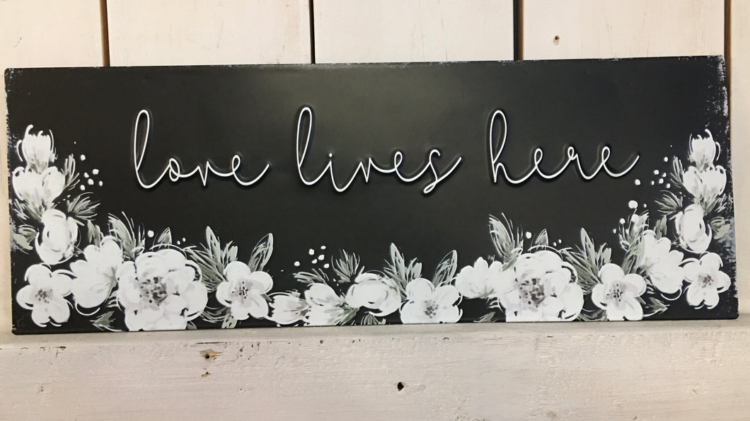 Love Lives Here metal sign